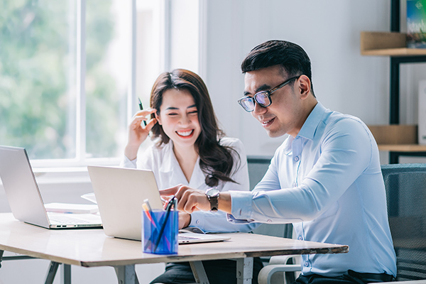 Two people working together in a modern office
