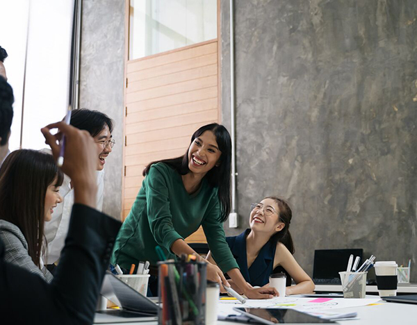 Group of professionals having a casual meeting in a boardroom